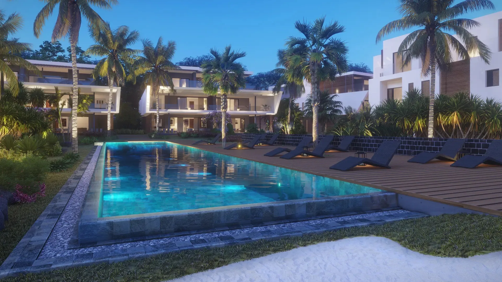 Pool and residences of The Peninsula development at dusk, Black River, Mauritius