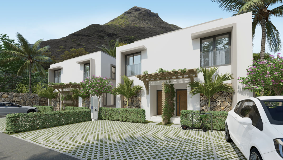 Exterior view of Zetwal Cap Tamarin townhouse with a breathtaking panorama of La Tourelle Mountain, presented by Westimmo Luxury Real Estate