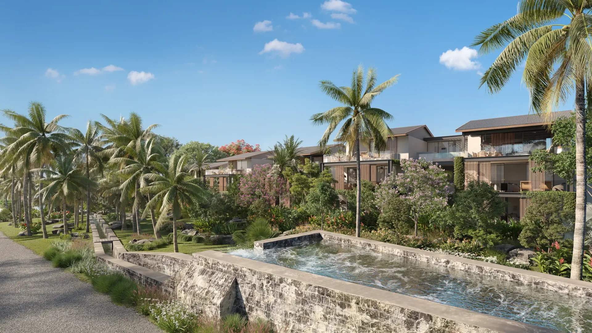 Résidences d’appartements et bassin en pierre le long de Palm Alley, Anahita Beau Champ, côte Est de l’île Maurice